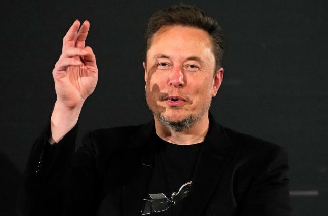File - Elon Musk, owner of social media platform X, gestures during an event with Britain's Prime Minister Rishi Sunak in London on Nov. 2, 2023. IBM has stopped advertising on X after a report said its ads were appearing alongside material praising Adolf Hitler and Nazis. 
