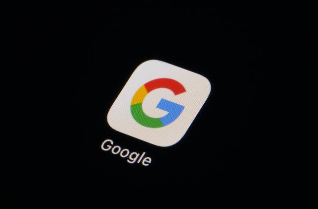 FILE - The Google app icon is seen on a smartphone, Tuesday, Feb. 28, 2023, in Marple Township, Pa. A Russian court has fined Google for failing to store personal data on its Russian users, the latest in a series of fines on the tech giant amid tensions between Russia and the West over the war in Ukraine. A magistrate at Moscow’s Tagansky district court on Tuesday, Nov. 14, 2023 fined Google around $164,200 after the IT company repeatedly refused to store personal data on Russian citizens in Russia. (AP Photo/Matt Slocum, File)
