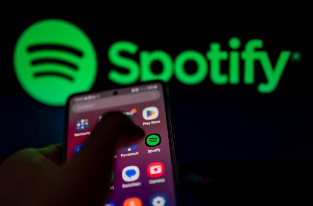 Spotify logo displayed on a smart phone with Spotify seen on screen, in this photo illustration, on 15 August 2023 Brussels, Belgium. (Photo Illustration by Jonathan Raa/NurPhoto via Getty Images)