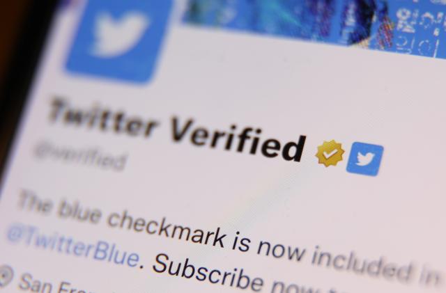 The gold checkmark on Twitter Verified account on Twitter is seen displayed on a phone screen in this illustration photo taken in Krakow, Poland on February 14, 2023 (Photo by Jakub Porzycki/NurPhoto via Getty Images)