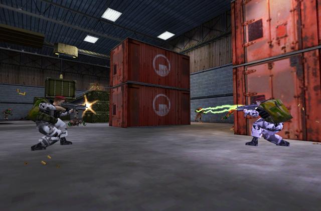 Soldiers and aliens battle in an industrial area.