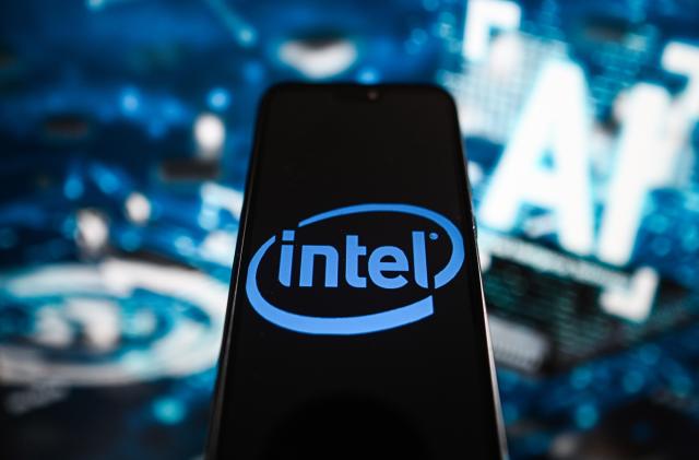 POLAND - 2023/07/19: In this photo illustration an Intel logo is displayed on a smartphone with Artificial Intelligence (AI) symbols in the background. (Photo Illustration by Omar Marques/SOPA Images/LightRocket via Getty Images)