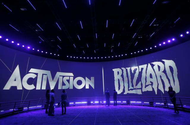 FILE - The Activision Blizzard Booth is shown on June 13, 2013, during the Electronic Entertainment Expo in Los Angeles. British antitrust regulators scrutinizing Microsoft's blockbuster purchase of videogame maker Activision Blizzard narrowed their investigation on Friday, March 24, 2023 by dropping concerns the deal would hurt the console gaming market. (AP Photo/Jae C. Hong, File)