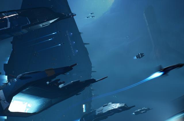 Several spaceships fly against a deep blue background.