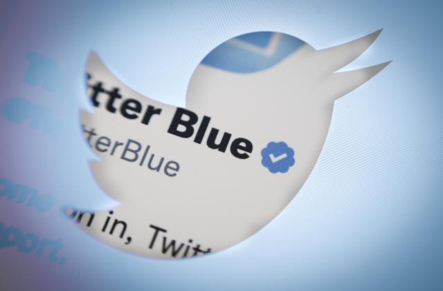 The Twitter Blue Checkmark is seen in this photo illustration in Warsaw, Poland on 21 September, 2022. Twitter management has announced the introduction of a new verification label to replace the blue check previously given only to verified accounts. As the director of the service, Esther Crawford explains, unlike the blue symbol this one will be gray and it will be free. Twitter management has announced the introduction of a new verification label to replace the blue check previously given only to verified accounts. As the director of the service, Esther Crawford explains, unlike the blue symbol this one will be gray and it will be free. Verified accounts will now have an 'Official' badge under their username, along with a gray verification tag. All previously verified accounts will receive the 'official' check mark which will not be available for purchase and not everyone will be eligible. (Photo by STR/NurPhoto via Getty Images)