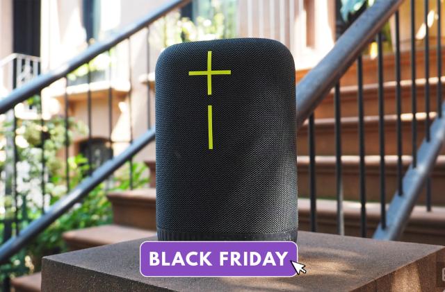 The Ultimate Ears Epicboom portable speaker sits on a stoop out front of a building. The Black Friday overlay is on the image.