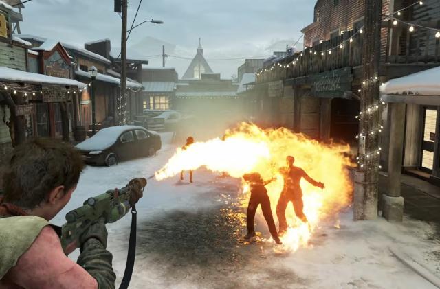 A person shown from behind uses a flamethrower to set several enemies ablaze on an ice-covered street. Screenshot is taken from The Last of Us Part 2 Remastered's No Return mode.