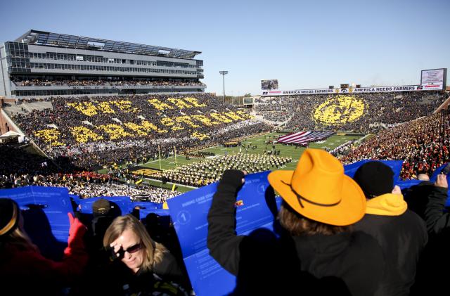 IOWA CITY, IA - NOVEMBER 01:  Fans in attendance to watch the Iowa Hawkeyes match-up against the Northwestern Wildcats perform a card stunt on November 1, 2014 at Kinnick Stadium in Iowa City, Iowa.  (Photo by Matthew Holst/Getty Images)