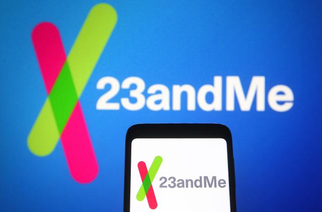 UKRAINE - 2021/06/17: In this photo illustration, 23andMe logo of a biotechnology company is seen on a smartphone and a pc screen in the background. (Photo Illustration by Pavlo Gonchar/SOPA Images/LightRocket via Getty Images)