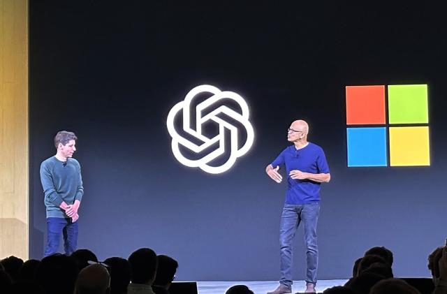 File - Sam Altman, left, appears onstage with Microsoft CEO Satya Nadella at OpenAI's first developer conference, on Nov. 6, 2023, in San Francisco. Microsoft snapped up Altman for a new venture after his sudden departure from OpenAI shocked the artificial intelligence world. (AP Photo/Barbara Ortutay, File)